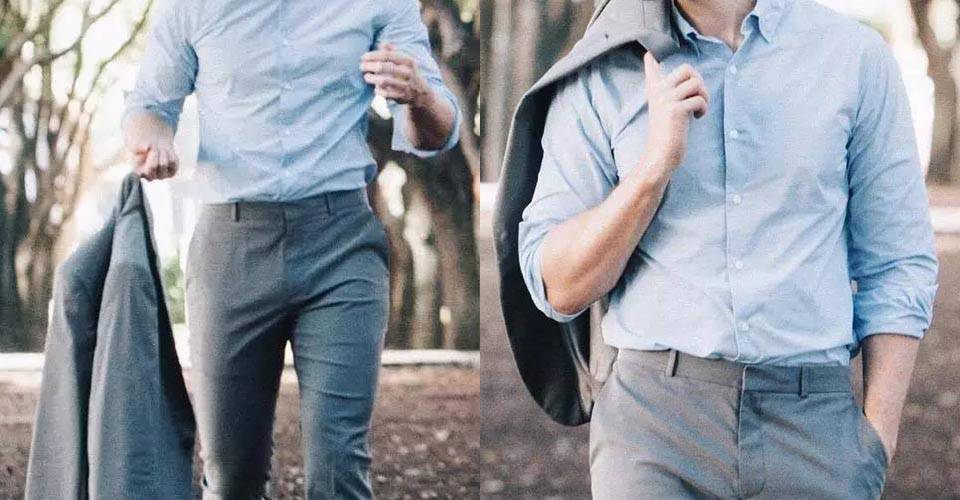 身著藍色襯衫及灰色西褲的男士